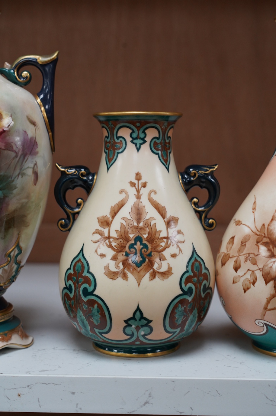 Hadley's Worcester: a pair of vases and two others, tallest 21.5cm. Condition - mostly good, largest vase has two chips to inner upper rim, areas of wear to gilding